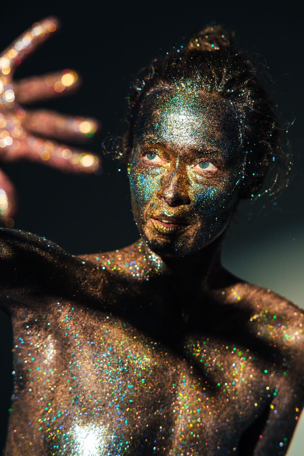 Face and shoulders covered in glitter