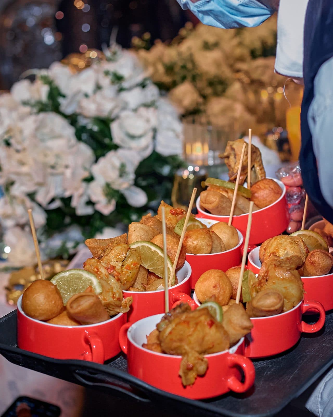 Fried bites and fritters served in red cups