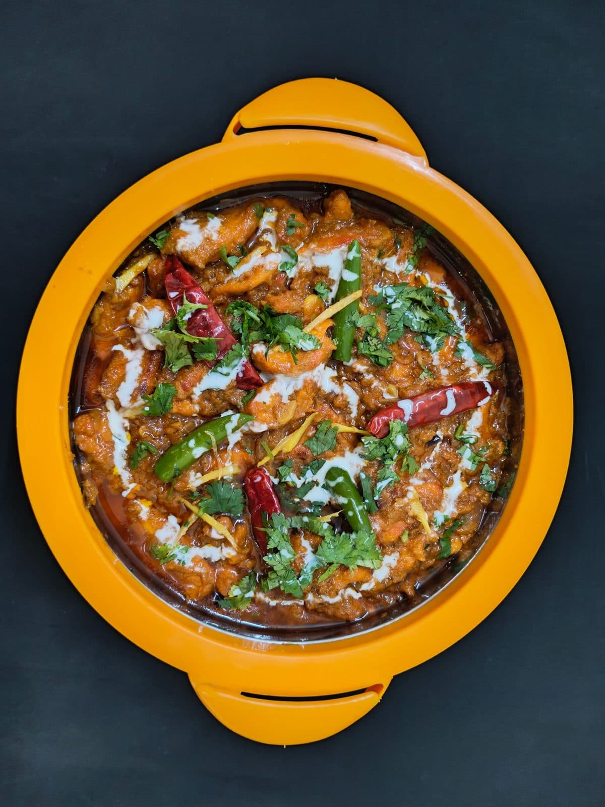 Curry topped with coriander and chillies