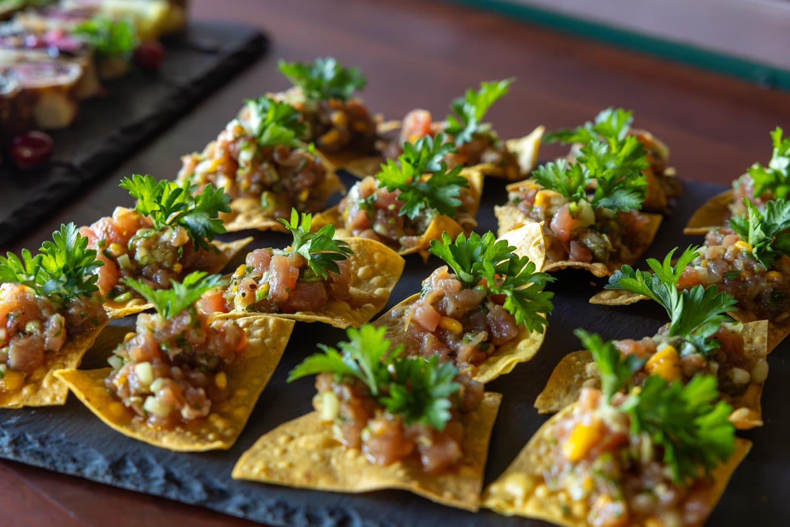 Tostadas topped with tartare and coriander