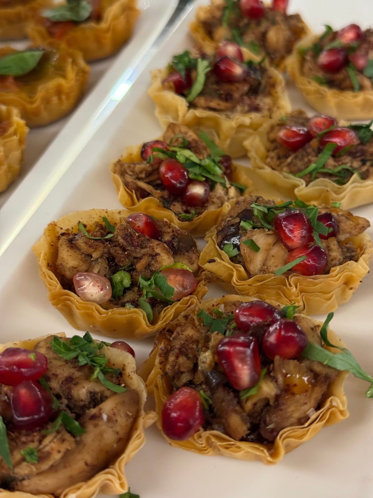 Middle Eastern pastries topped with pomegranate